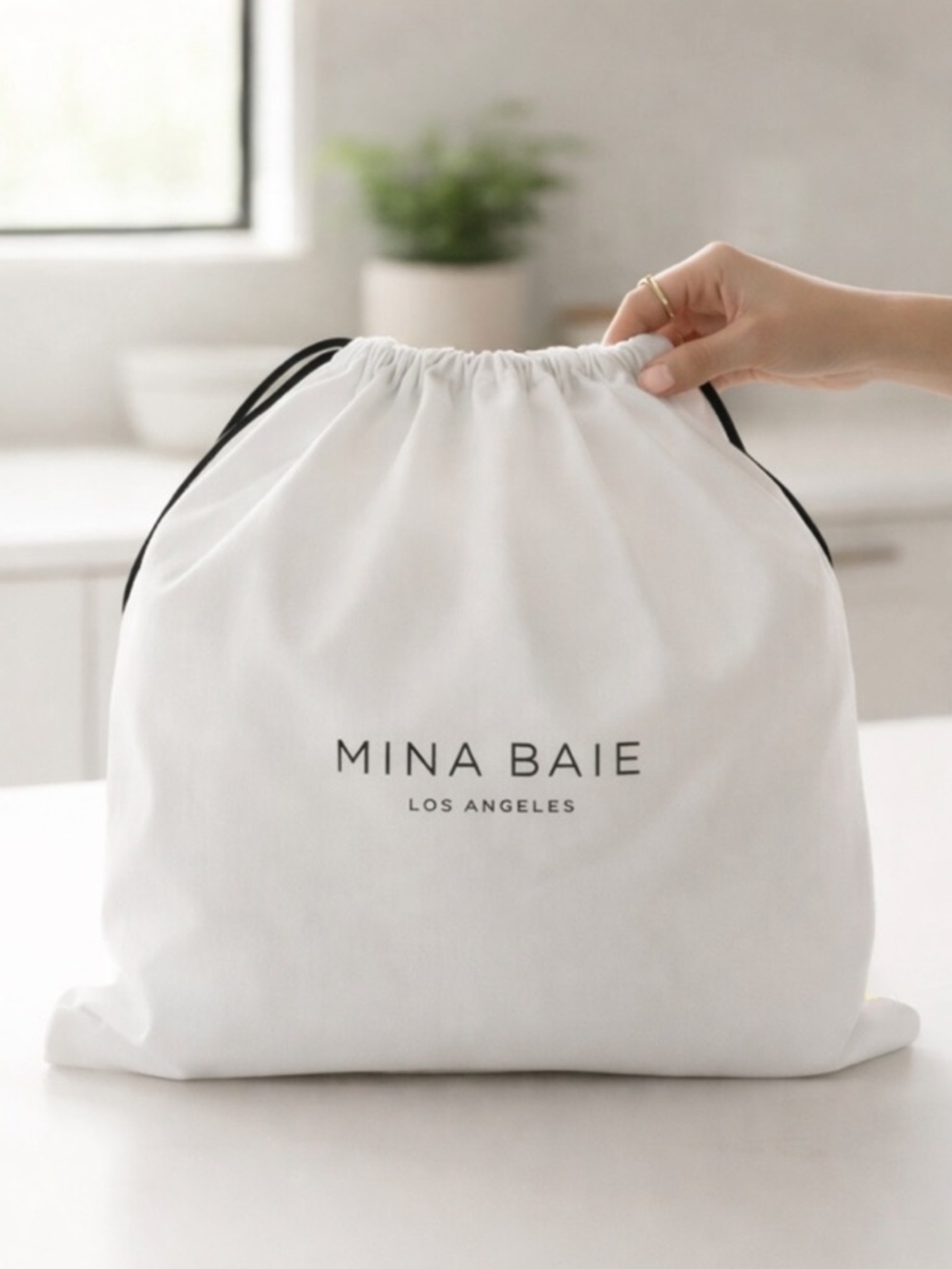 NWOT MINA BAIE White Dust Bag Drawstring Storage Pouch Designer Logo